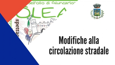 triangolo rosso, triangolo blu, sullo sfondo locandina evento Olea a Giuncarico, logo comune di Gavorrano su sfondo bianco, scritta "modifiche alla circolazione stradale